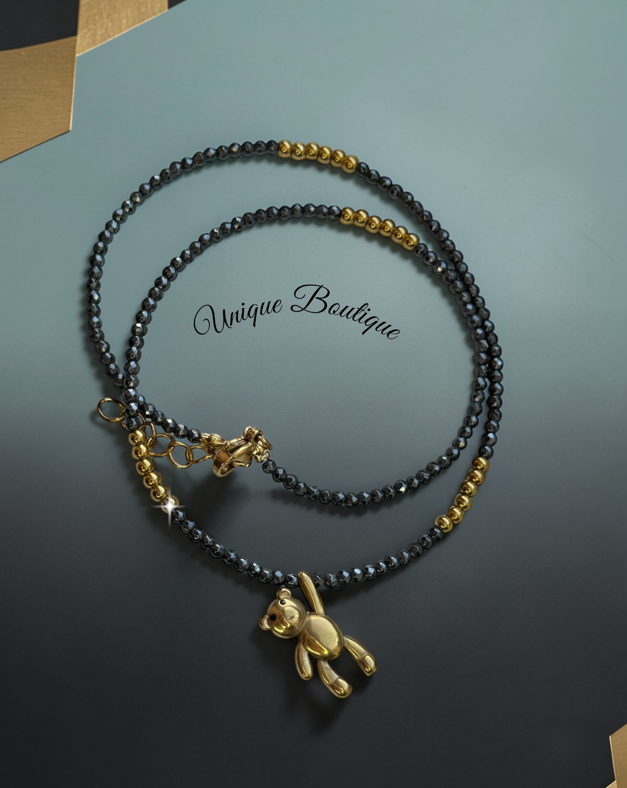 колие от Хематит и мече в златно